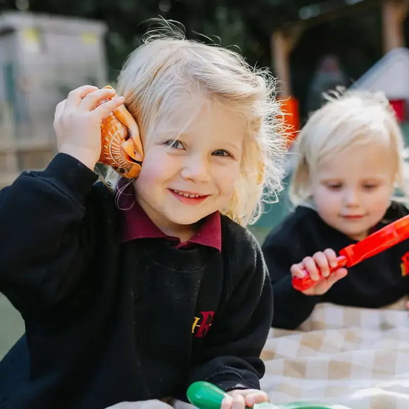 Nursery pupils playing outside at Radnor House Sevenoaks