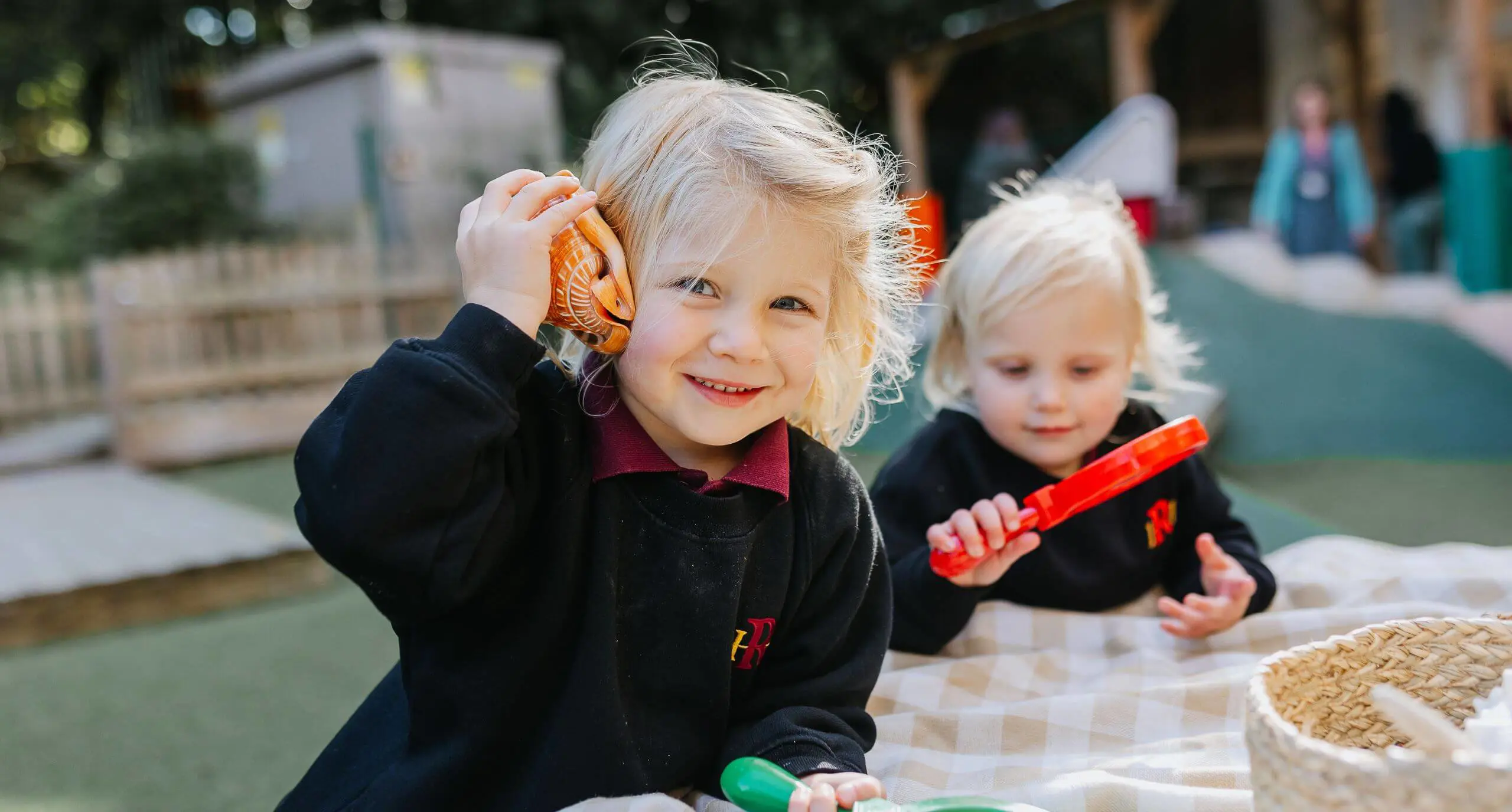 Nursery pupils playing outside at Radnor House Sevenoaks