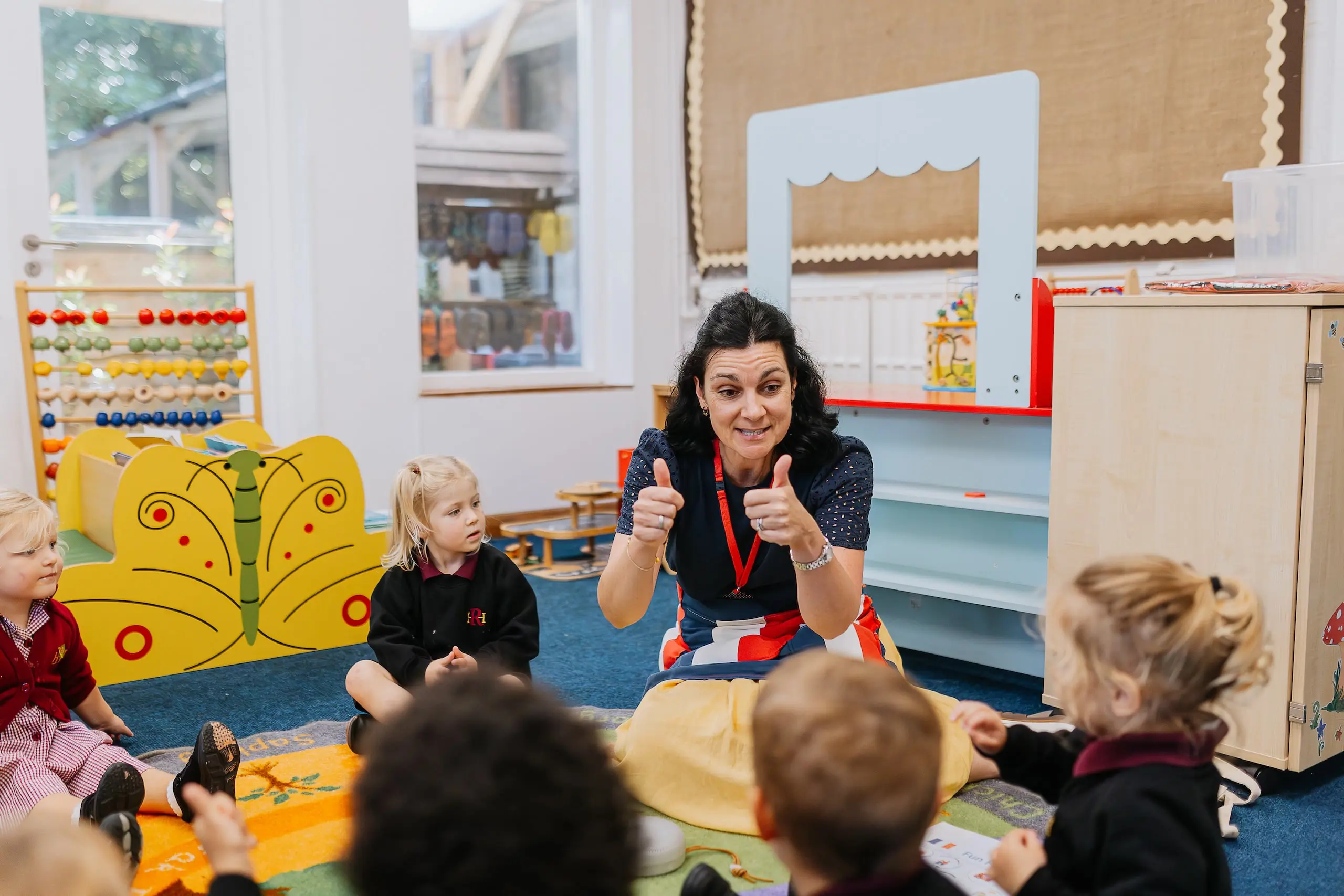 Teacher giving students the thumbs up