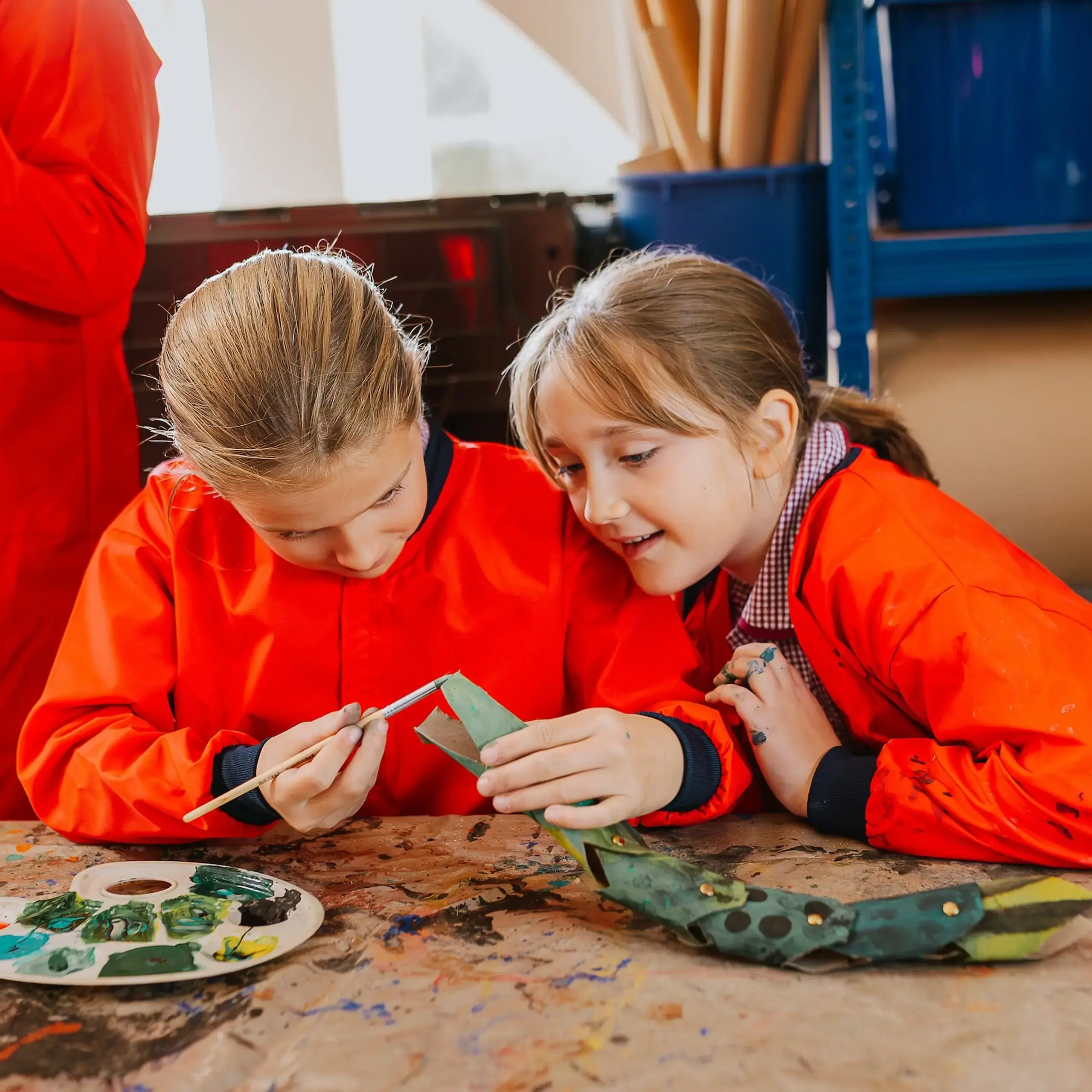 Students painting together in an art lesson