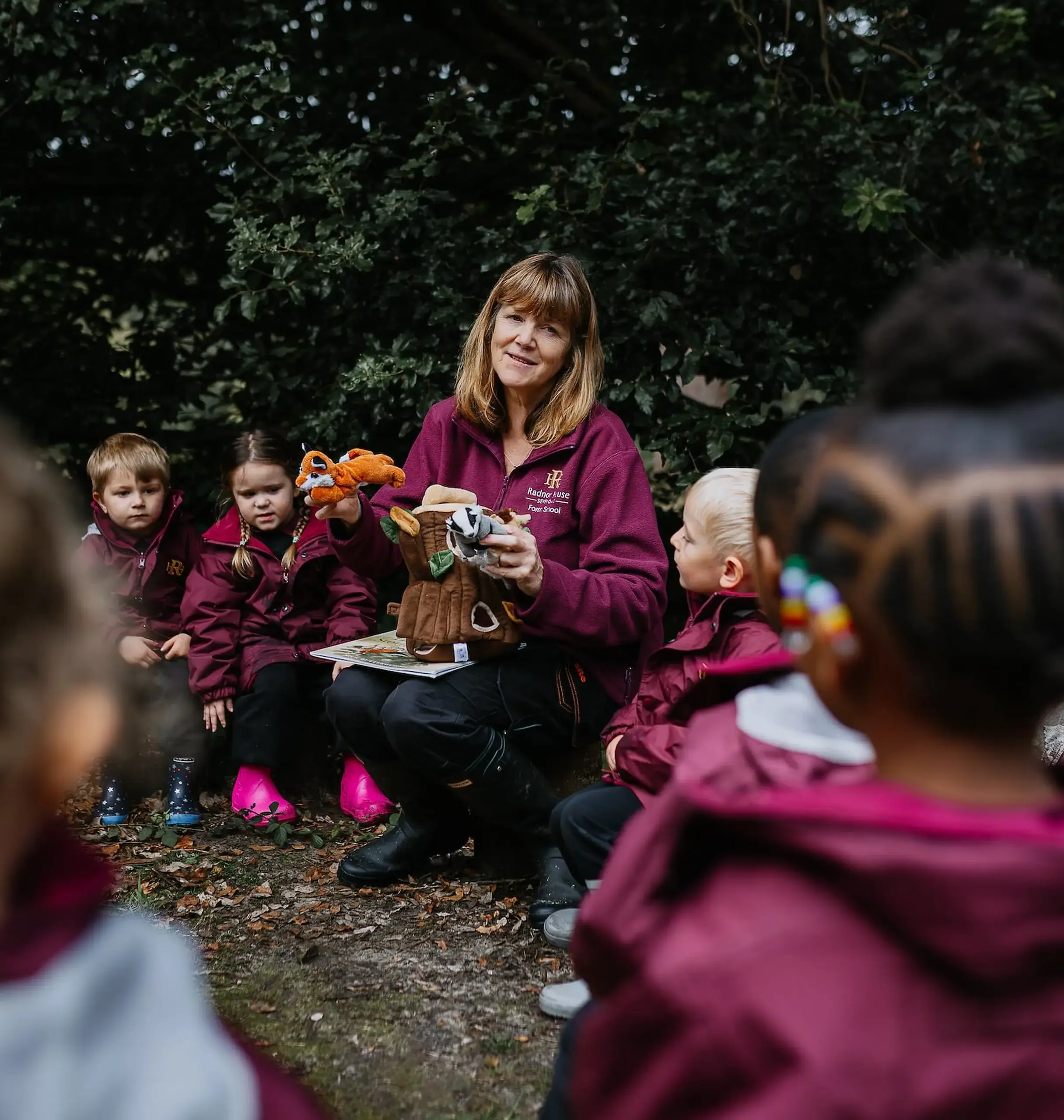 Radnor teacher supervising children in forest school