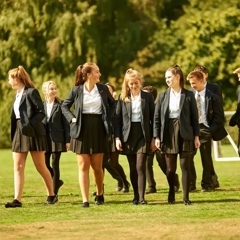 Senior school pupils walking across the field