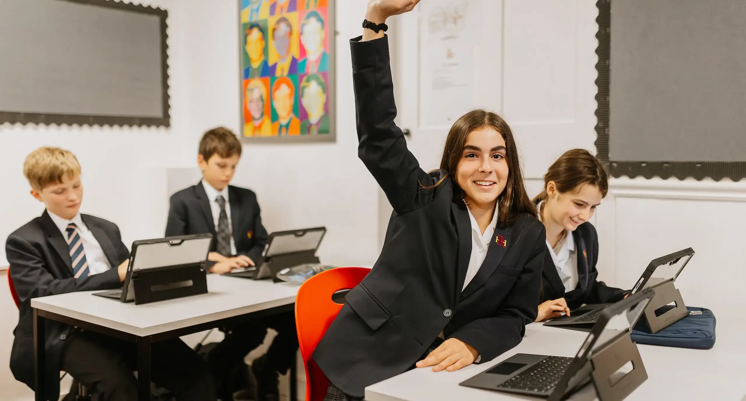 Radnor student with their hand raised in a lesson