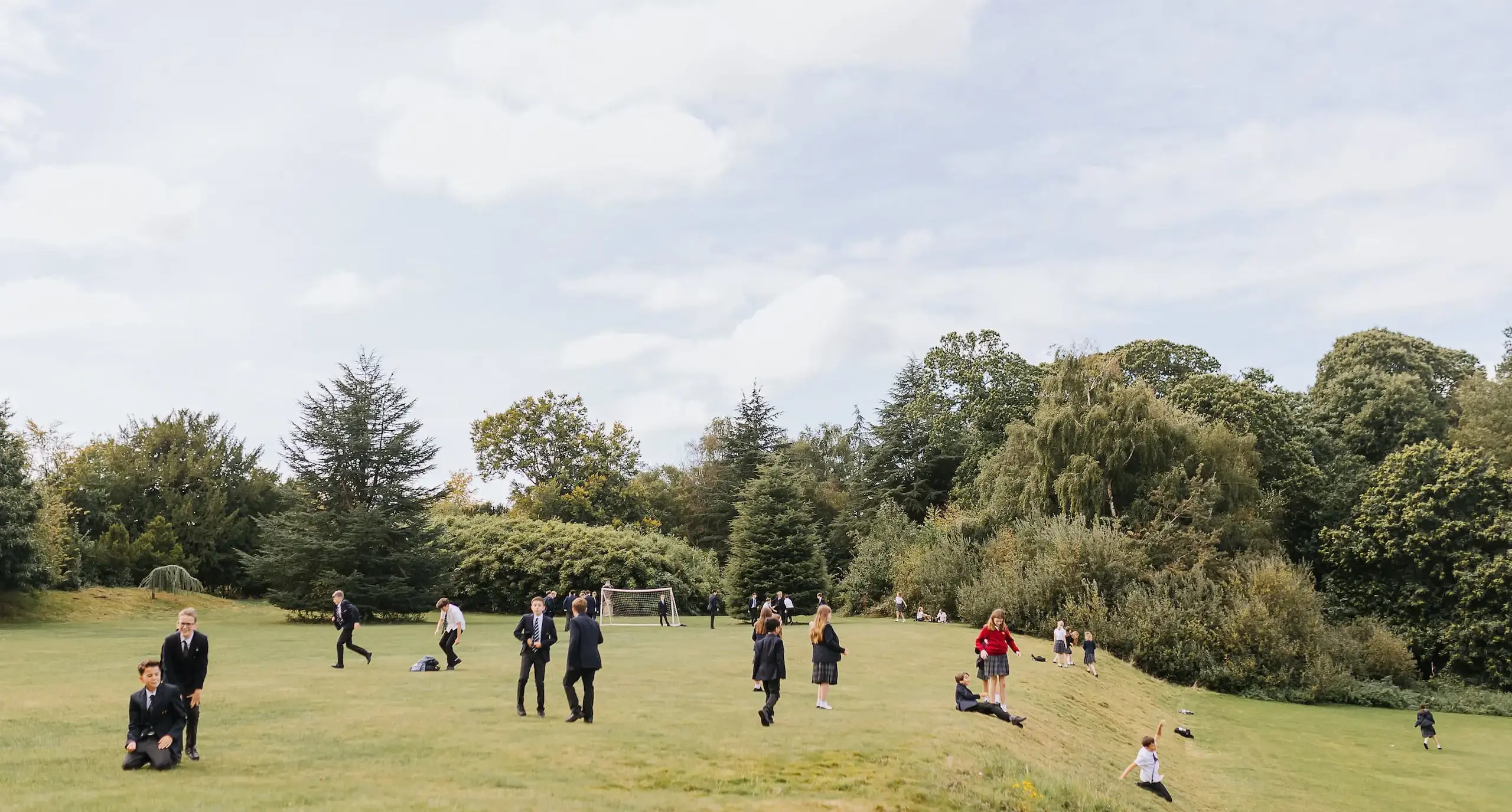 Students dotted around a field