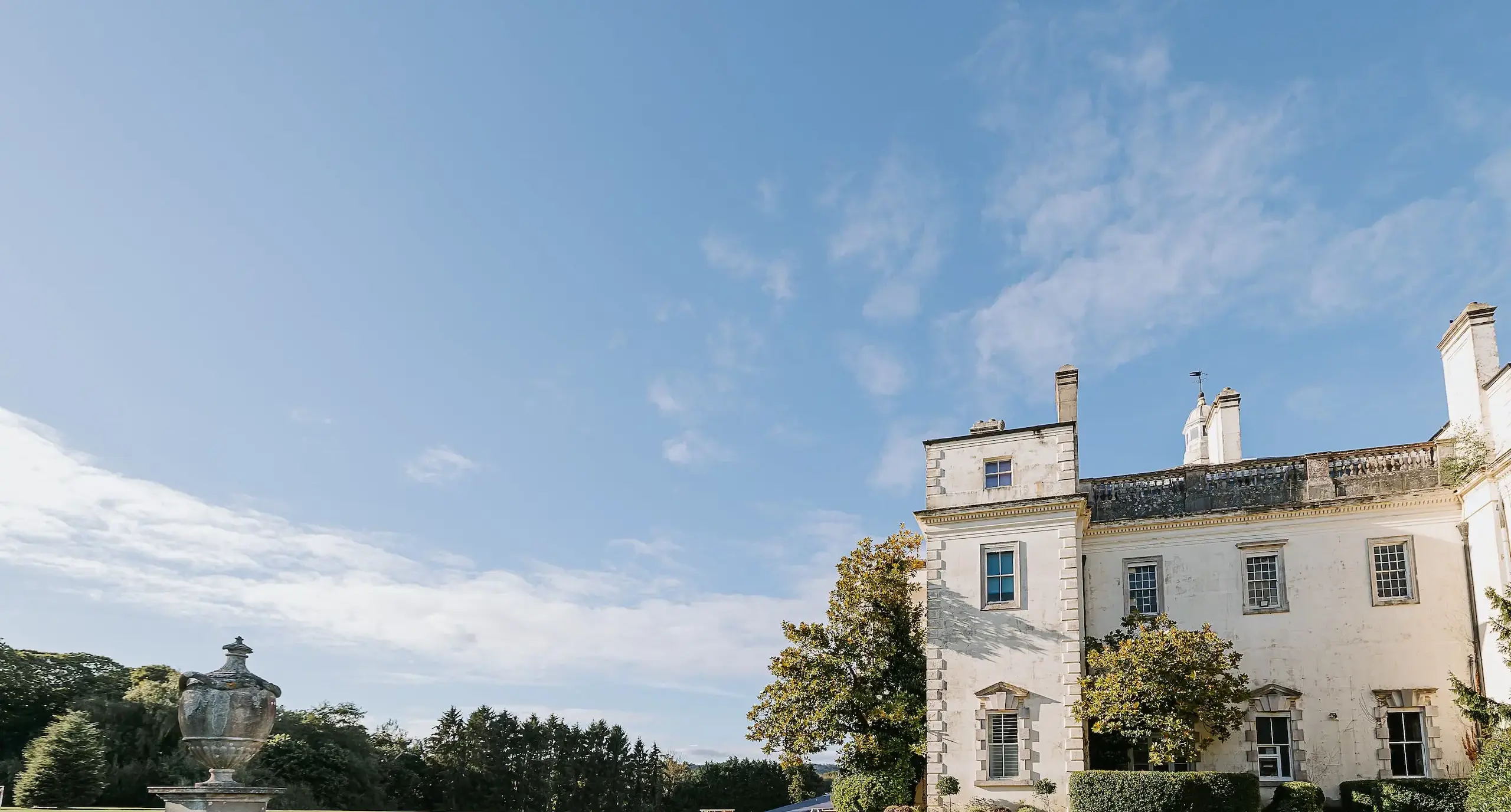 Exterior of Radnor House building against backdrop of woodland